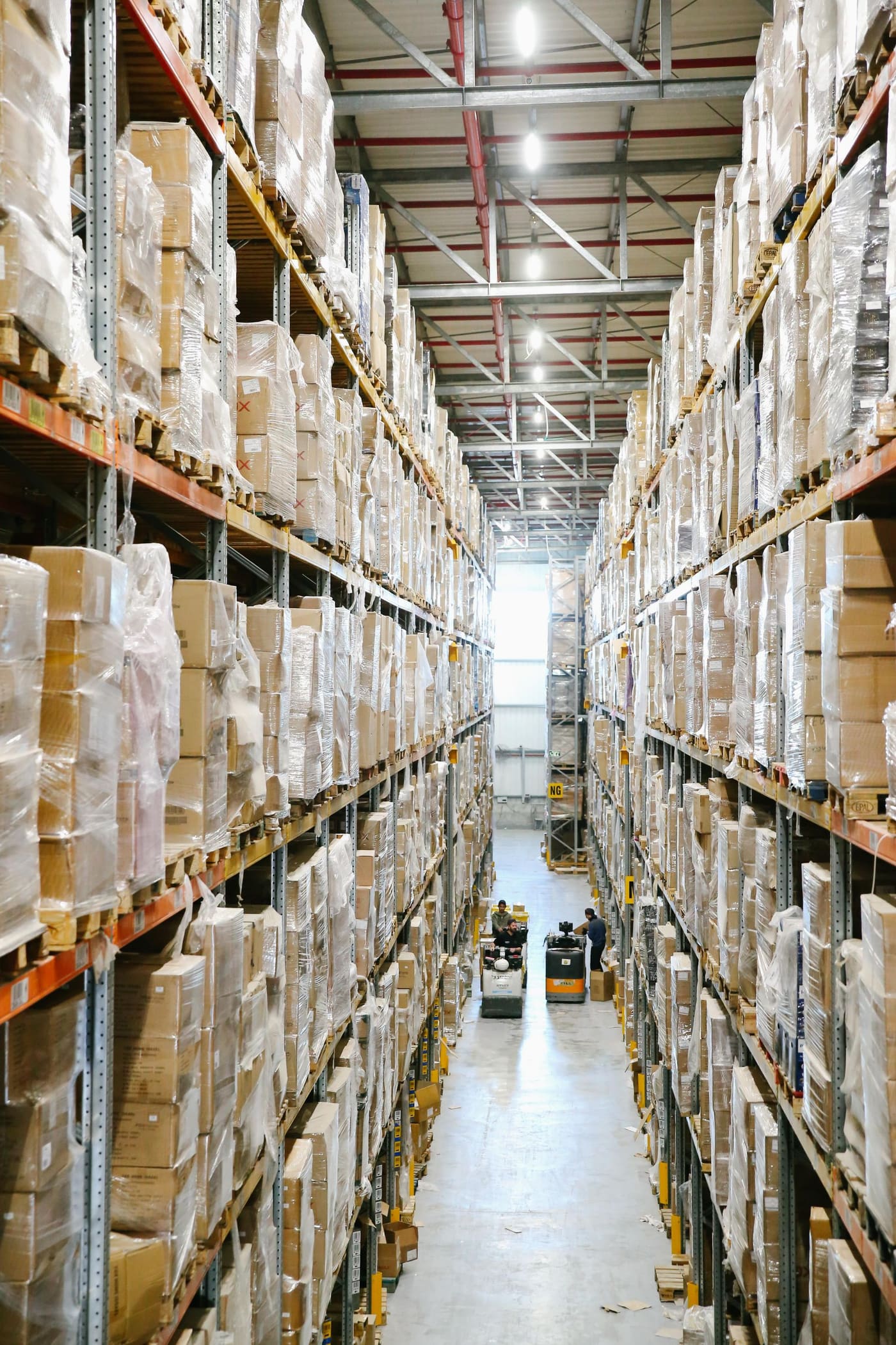 Organised warehouse aisle used to illustrate structured trial-device logistics